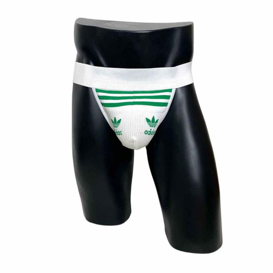 A jockstrap made from up-cycled white and green Adidas socks, displayed on a black mannequin.